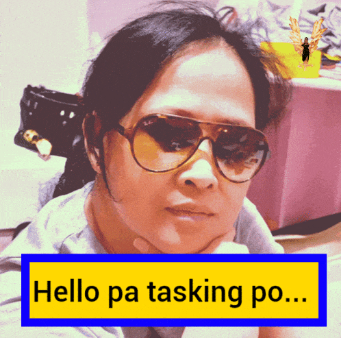 a woman wearing sunglasses and a yellow sign that says hello pa tasking po..