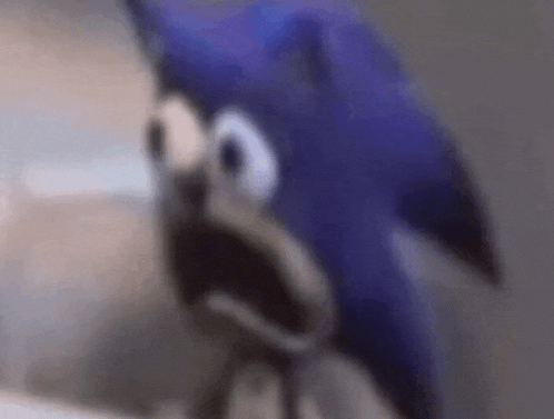 a close up of a cartoon character with a surprised expression on his face .