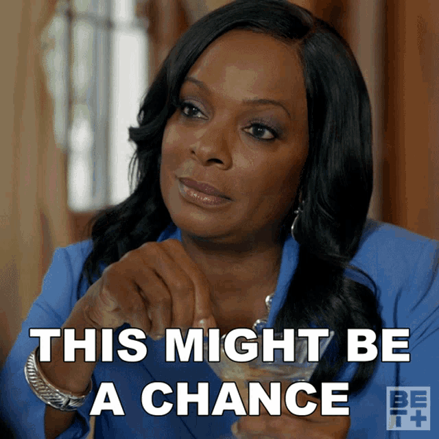 a woman in a blue shirt has the words this might be a chance on her face