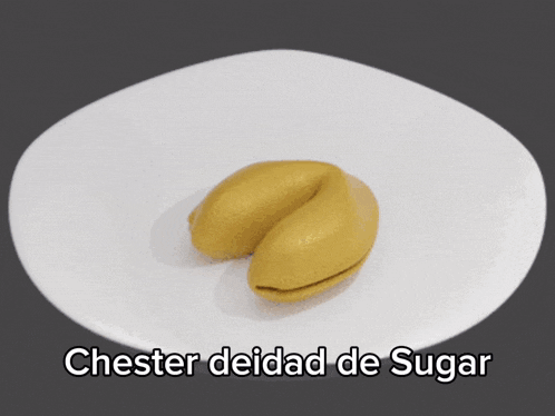 a fortune cookie with a picture of a cow and the words " chester deidad de sugar " below it