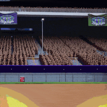a stadium full of people with a banner that says evil big tops