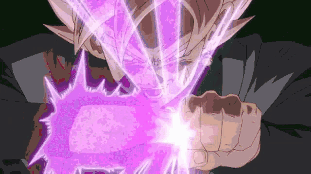 a man in a black suit is holding a purple object in his hands .