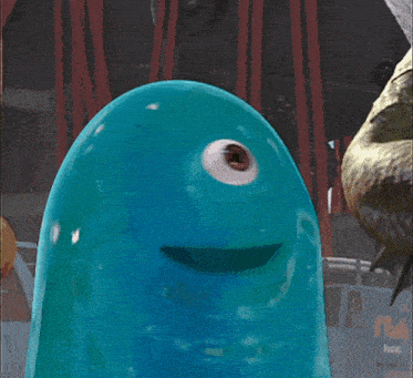 a close up of a blue cartoon character with a car in the background that says pacific
