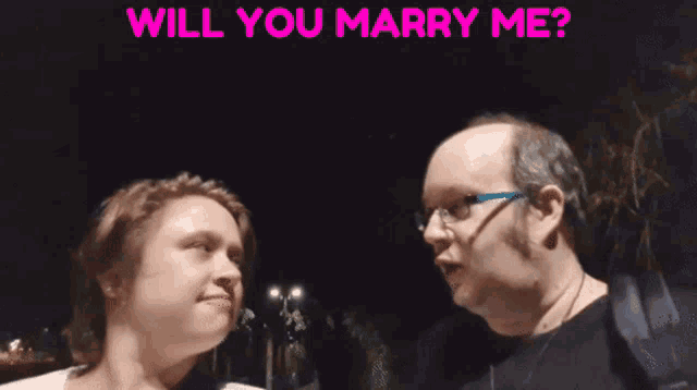 a man and woman are looking at each other with the words will you marry me