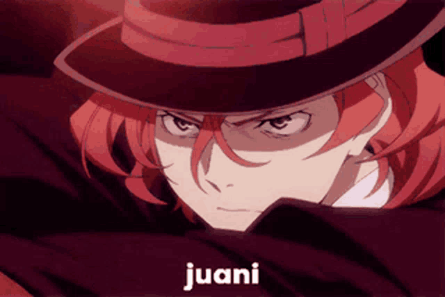 a close up of a person wearing a hat with the word juani on the bottom right