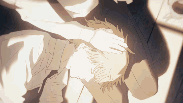 a drawing of a man laying on the floor with a hand on his head