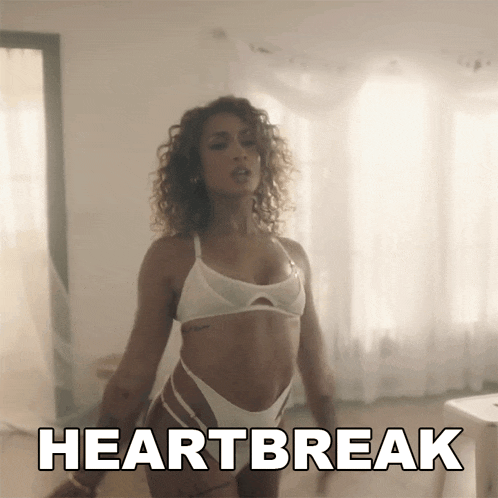 a woman in a white bikini is dancing with the word heartbreak written above her