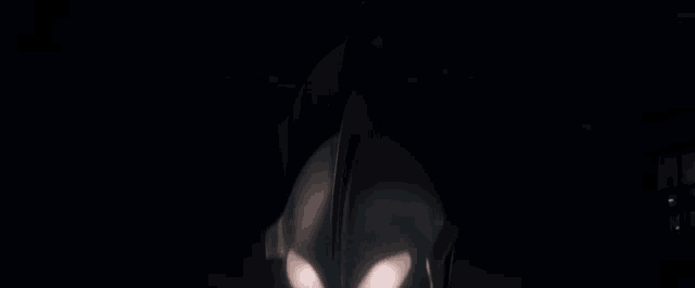 a close up of a robot 's eyes with a glowing light coming out of them