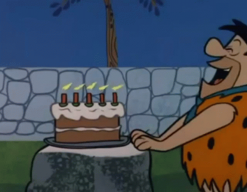 Fred Flintstone Blow Out Candles GIF - Fred Flintstone Blow Out Candles Blowing GIFs