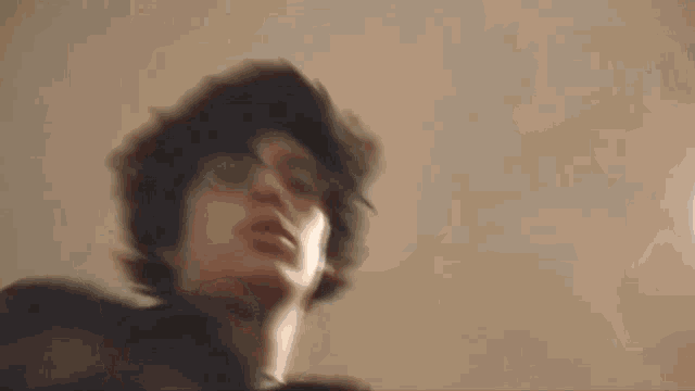 a blurred image of a person 's face with a few lines visible