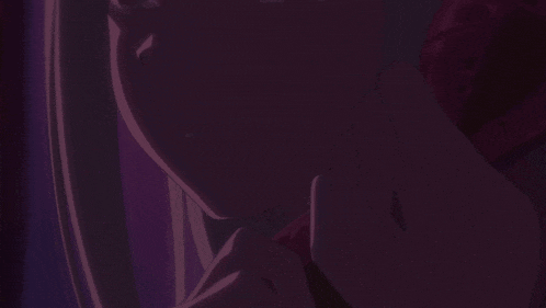 a close up of a woman 's face in a dark room