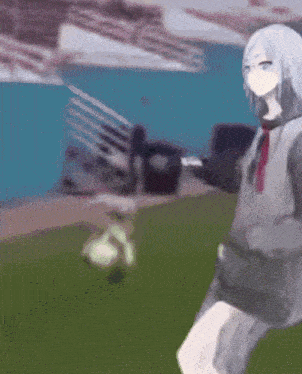 a blurred image of a person kicking a soccer ball