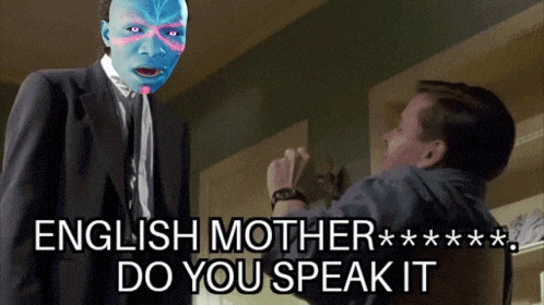 a man in a suit is talking to another man with the words english mother do you speak it below him