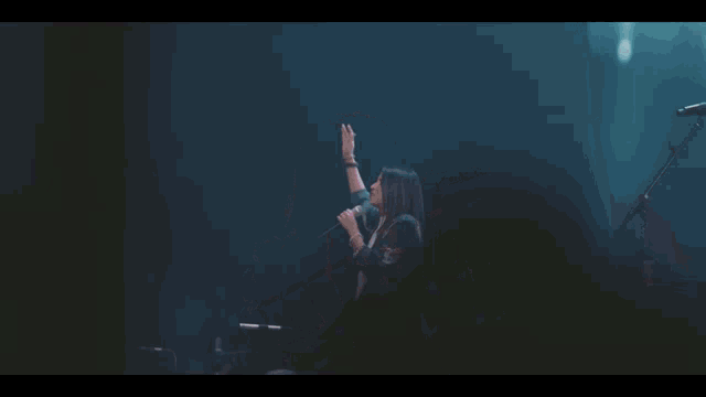 a group of people playing instruments on a stage