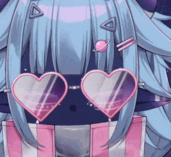 a close up of a person wearing heart shaped glasses