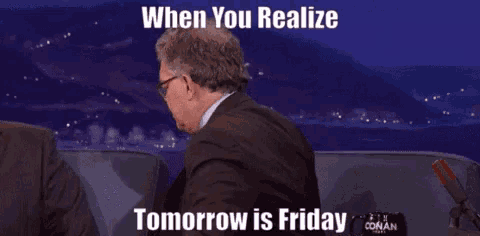 a man wearing glasses and a suit is making a funny face while talking on a show .