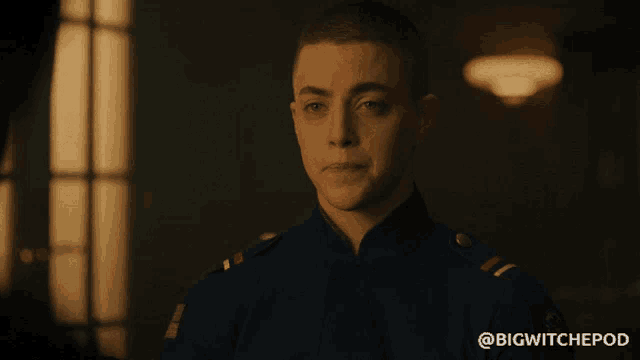 a man in a blue uniform with the hashtag bigwitchepod on the bottom