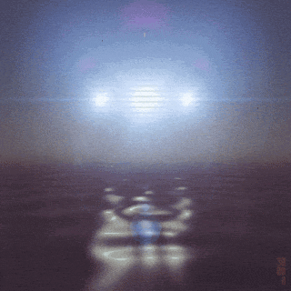 a car 's headlights are shining brightly in a blurry photo