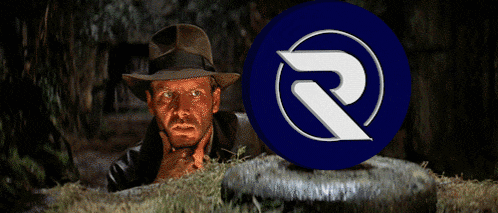 a man in a hat is looking at a blue circle with the letter r in it
