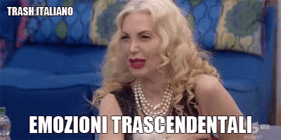a woman with blonde hair and a pearl necklace is sitting on a couch with the words trash italiano on the bottom