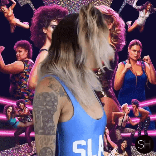a woman in a blue tank top with sla on it