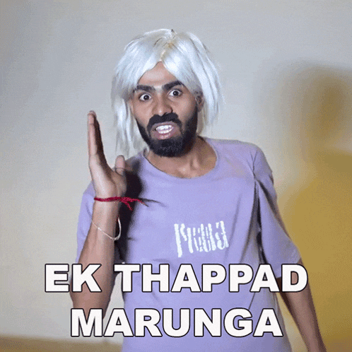 a man wearing a white wig and a purple shirt says " ek thapppad marunga "