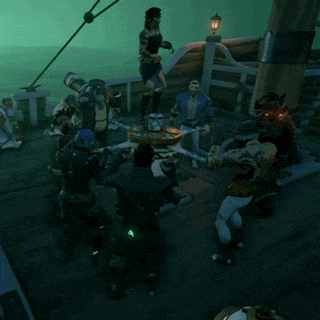 a group of people are standing around a table with a green light on it