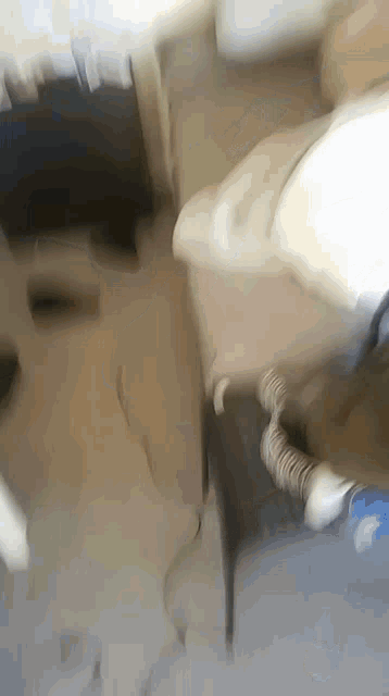 a snake is crawling on a table in a bedroom .