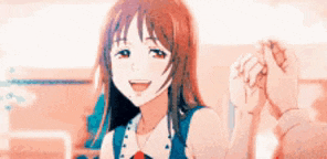 a girl in a blue dress is holding a man 's hand while smiling .