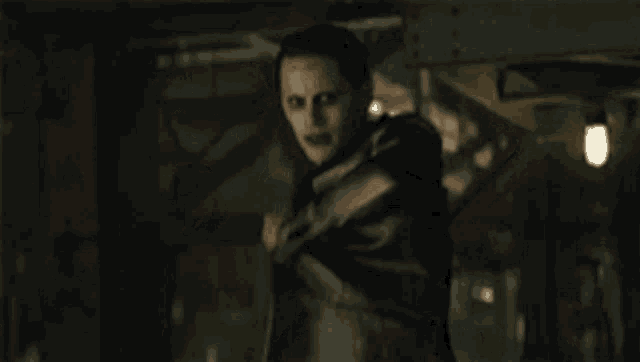 a close up of the joker from the movie suicide squad
