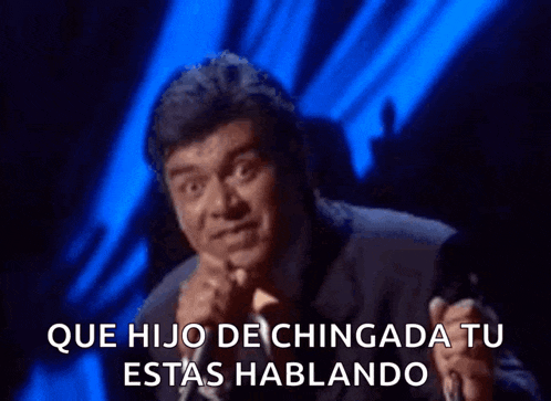 a man singing into a microphone with the words que hijo de chingada tu estas hablando written below