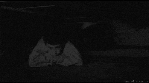a black and white photo of a scary clown with a huge mouth