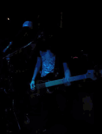 a man playing a guitar with a shirt that says tiger on it