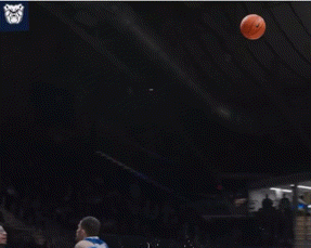 a basketball player with the number 23 on his jersey is jumping in the air