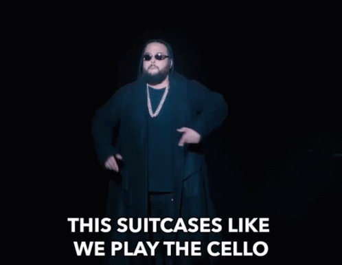 This Suitcases Like We Play The Cello Mime GIF - This Suitcases Like We Play The Cello Mime Singing GIFs