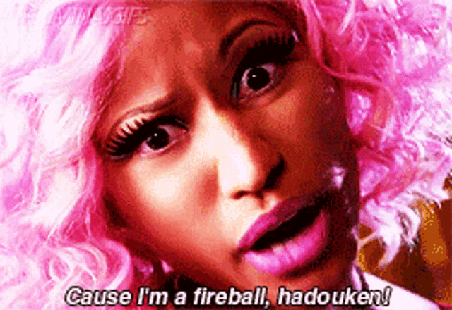 a woman with pink hair says cause i 'm a fireball