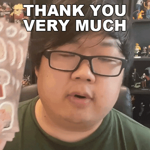 a man wearing glasses says thank you very much while holding a piece of paper