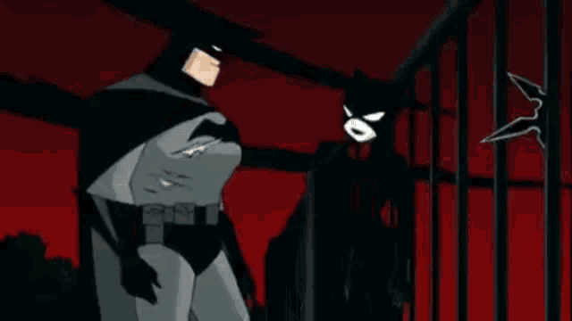 two cartoon characters , batman and robin , are standing next to each other in a prison cell .