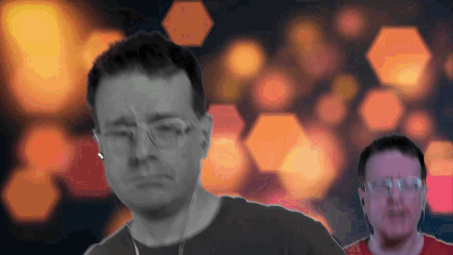 a blurry picture of a man wearing glasses