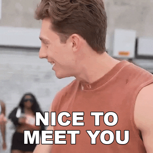 a man in a tank top is smiling and says nice to meet you