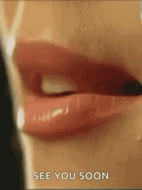 a close up of a woman 's lips with the words `` see you soon '' .