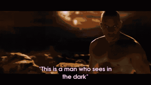 a man with horns is standing in the dark with the words " this is a man who sees in the dark "