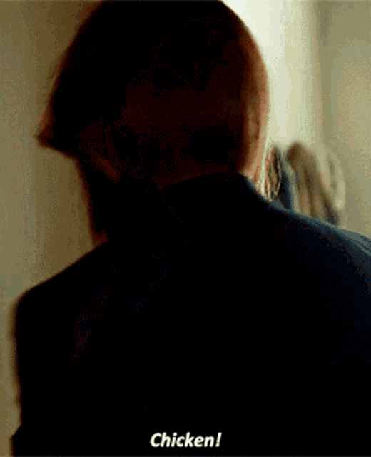 a woman in a black jacket says chicken