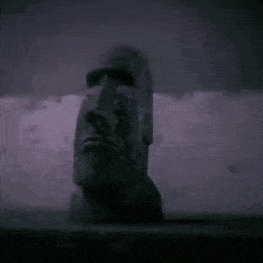 a blurred image of a person 's face with a purple background