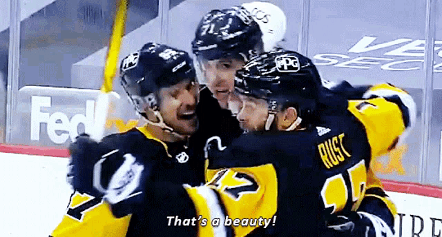 a hockey player says that 's a beauty while hugging another player