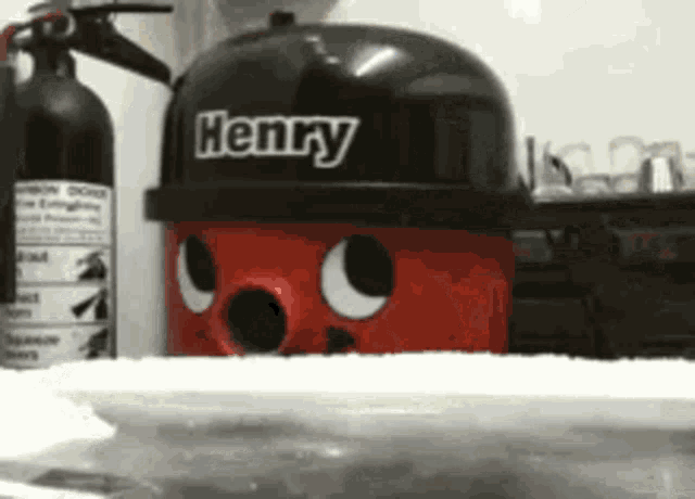 a henry vacuum cleaner is sitting on a table