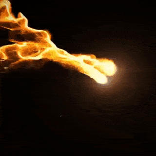 a close up of a fire coming out of a hole in the ground .