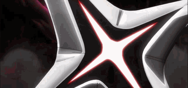 a close up of a star shaped object with a red center