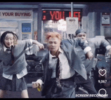 a group of people are dancing in front of a store called your buying
