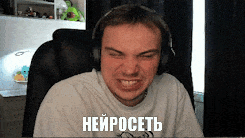 a man wearing headphones is making a funny face and has the word " neuroset " on his shirt